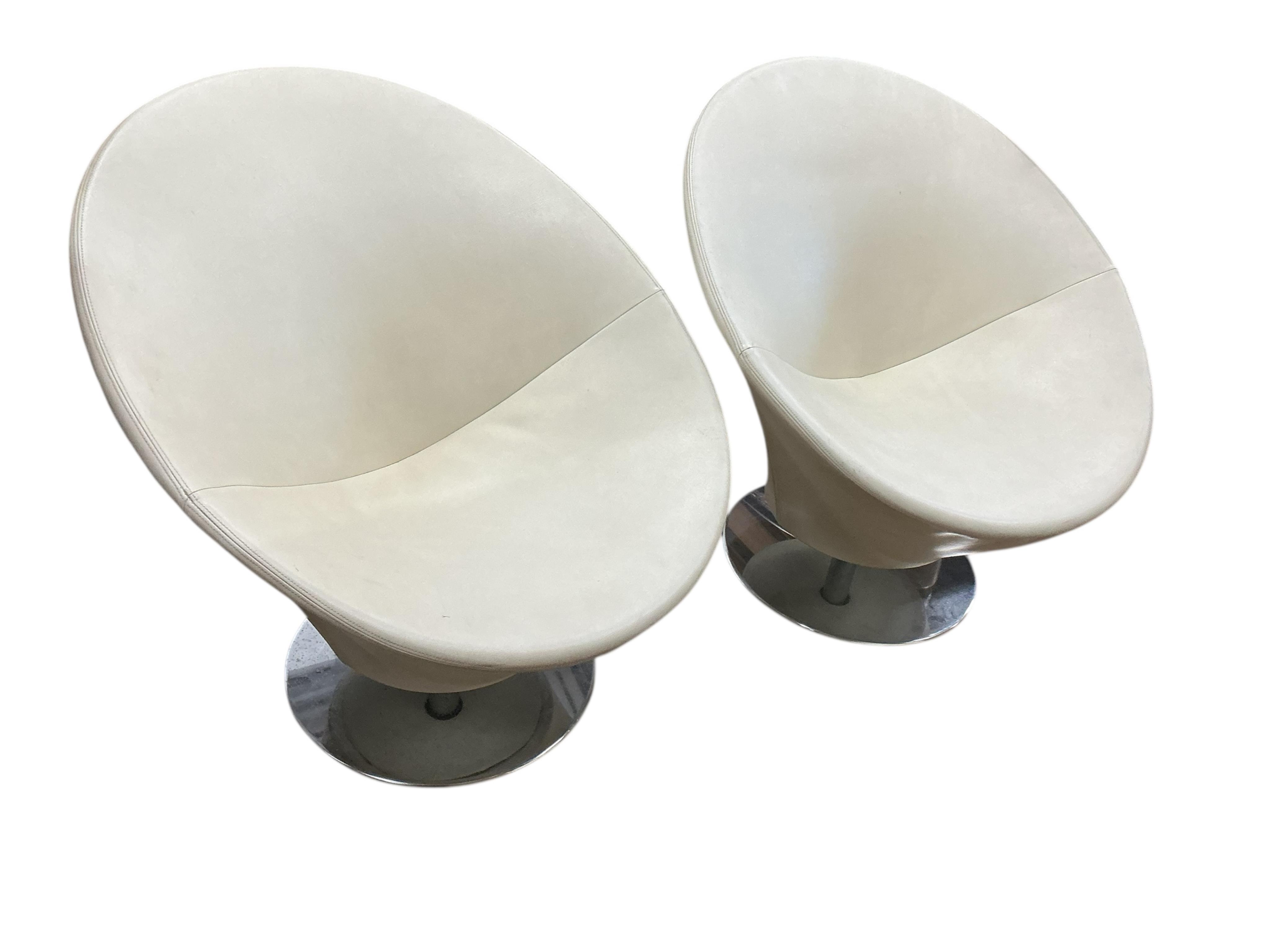 A pair of contemporary circular frame swivel lounge chairs on chrome bases, width 80cm, height 83cm